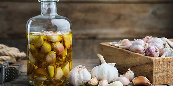 Garlic bulbs and cloves in oil