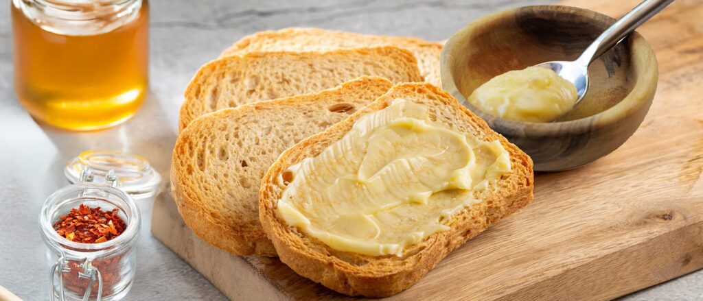 Toasted bread slices with honey and chili flakes for a savory and sweet meal