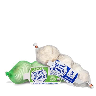 A mesh bag containing organic garlic bulbs from Spice World
