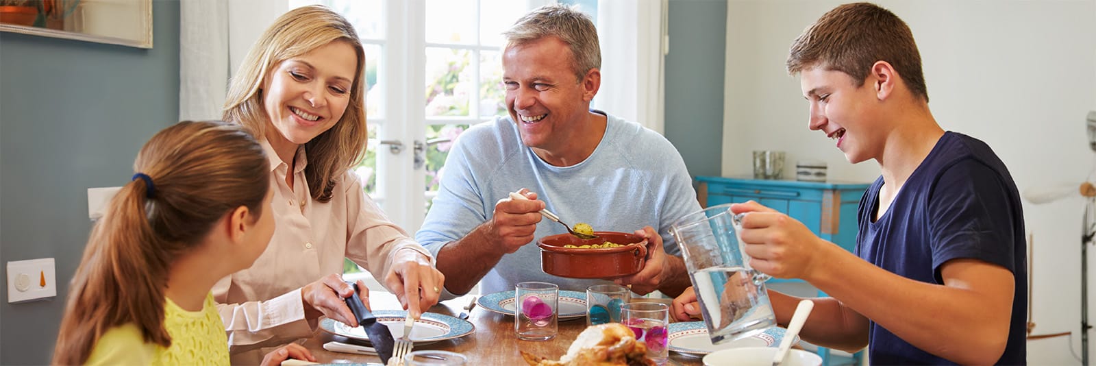 Family enjoying a meal together at home