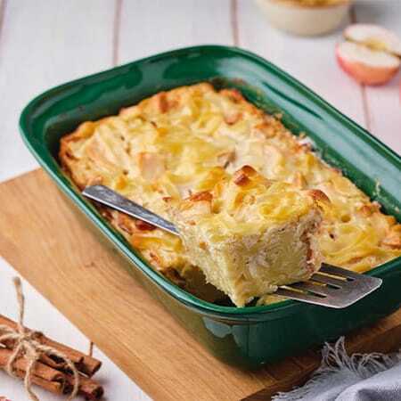 Scalloped potatoes in a green baking dish, served hot