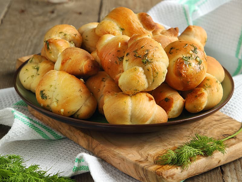 A platter of freshly baked, herb-infused rolls, perfect for sharing at meals or gatherings