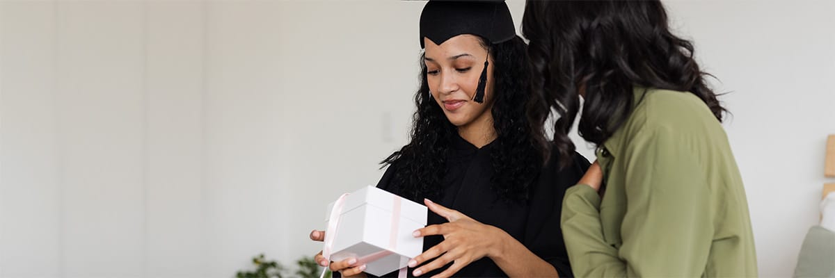 Celebrating a graduation with friends and delicious food gifts in a joyful atmosphere